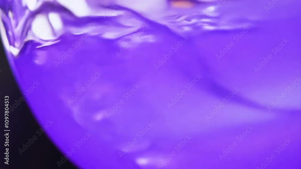 Wall mural purple swirl abstract: a captivating abstract image of a swirling purple liquid, creating a mesmeriz