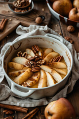 Fototapeta premium A baking dish with warm, baked apple and pear slices, topped with cinnamon and nuts. Generative AI tools