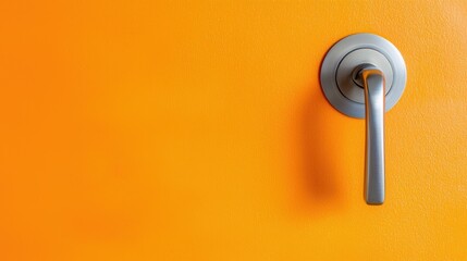 Modern Door Handle with Sleek Design Against Bright Orange Wall