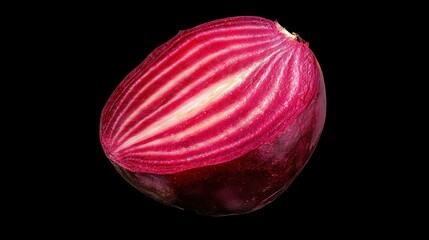 Fototapeta premium Vibrant Red Beetroot Half with Intricate Patterns on Black Background