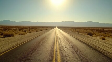 Naklejka premium Deserted road stretching through a wide-open desert, creating a classic road trip adventure