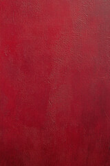 Fototapeta premium Red surface wall texture for vertical background, used painted wall