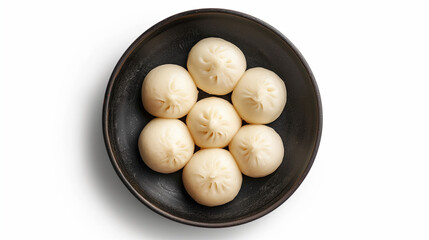 Soft bao buns arranged neatly in a black bowl on a white background