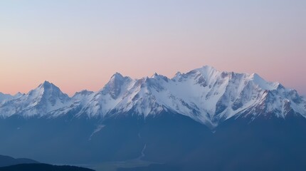Obraz premium Snow-capped mountain peaks at dawn