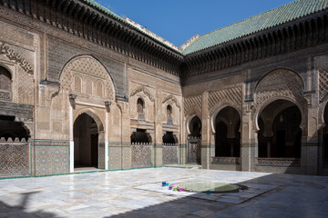 Fototapeta premium Bou Inania complex in Fes, Fès, Fez, Morocco. Courtyard, archs, mosaic, zellige, medersa, architecture.