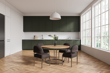 Modern kitchen interior with dark green cabinets and wooden table in bright room with large windows. 3D Rendering