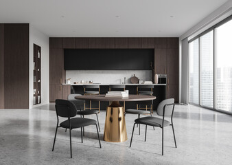 Modern kitchen interior with round table, chairs, and large windows in a spacious open-plan room, featuring dark wood cabinetry and city view. 3D Rendering