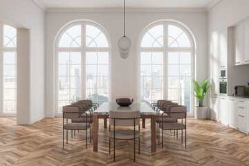 Modern kitchen dining area with large windows, wood flooring, and elegant contemporary furniture in a spacious home interior setting. 3D Rendering