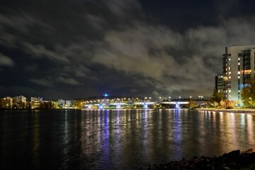 Fototapeta premium Stunning nighttime view of Jyvaskyla, Finland, showcasing city lights and serene atmosphere.