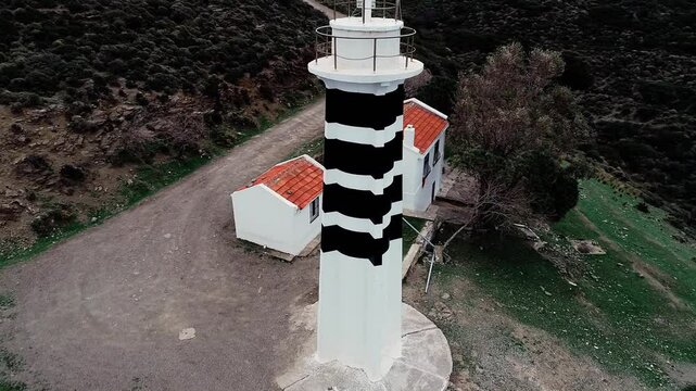 Sarpincik Historical Lighthouse, Izmir - High quality video of Izmir Sarpincik Lighthouse taken from the air with a drone on a cloudy day