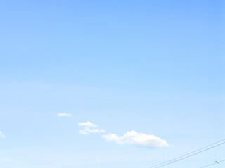 Minimal style background image, clear sky with few floating clouds, beautiful and natural.