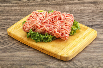 Raw pork minced meat over board