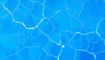 Clear turquoise water ripples across the pool's surface, creating an abstract pattern of light and shadow