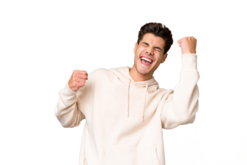 Young caucasian handsome man over isolated background celebrating a victory