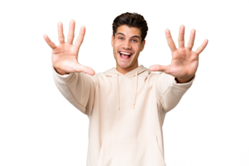 Young caucasian handsome man over isolated background counting ten with fingers
