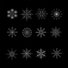Set of white snowflakes on a black background. For decorating Christmas and New Year projects.