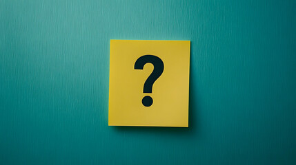 A yellow sticky note with a black question mark on a teal background. The image symbolizes uncertainty, inquiry, doubt, and seeking answers.