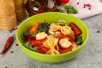 Italian pasta farfalle with pepperoni