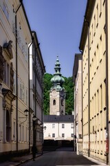Obraz premium Historic European street with church tower.