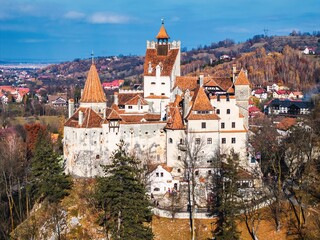 Obraz premium Aerial drone view of Bran Castle in autumn season