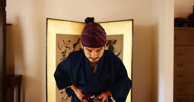 Respect, bow and martial arts sensei in dojo for practice routine, bushido and spirituality. Warrior, Japanese man and virtues for fighting, tradition and samurai culture for sports discipline
