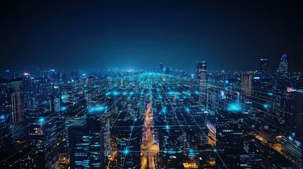 Fototapeta premium A stunning aerial view of a vibrant city skyline at night, illuminated by bright lights and showcasing a network of streets and buildings.