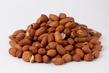 Fototapeta premium Pile of Roasted Peanuts on White Background