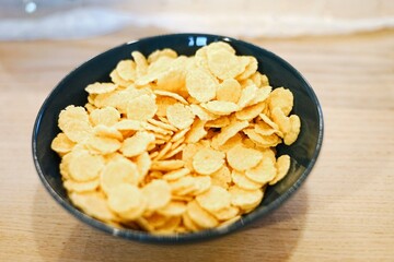 a blue bowl of dry cornflakes healthy diet breakfast cereal nutrition crisp