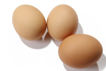 Three eggs on a white background