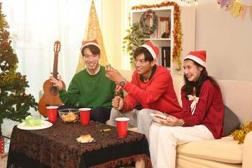 Friends Celebrating with Party Confetti Poppers, the excitement of a Christmas gathering creating laughter and holiday fun