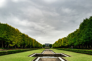 Fototapeta premium Symmetrical Park Scene Under Cloudy Skies
