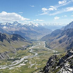 Obraz premium Wide-open highway through mountains and valleys, rugged terrain, green hills, blue sky above, wide-open space