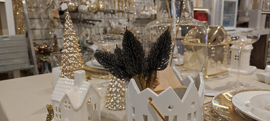 Trendy Christmas decor on family table, trendy Christmas decorations in shop window, 2025 trends in...