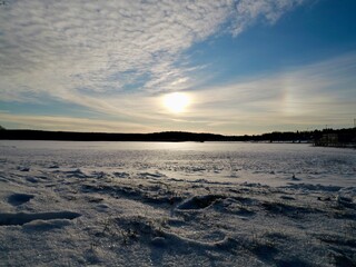 Obraz premium Sunshine winter morning over the snowy field. Sweden