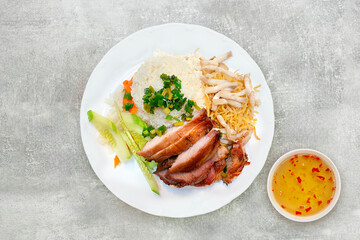 Broken rice with grilled pork chop, meatloaf and shredded pork skin. Vietnamese combination broken...