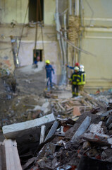 rescuers dismantling building of childrens hospital in kyiv destroyed by russian rocket attack