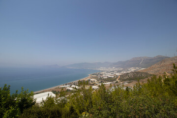 Obraz premium view a sea from the top of the mountain and a forest