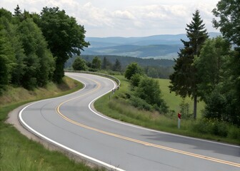 Fototapeta premium Curved Road Through Lush Green Landscape