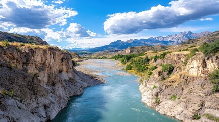 Serene Time Lapse of a River Cutting Through a Majestic Canyon Landscape with Lush Greenery and Dramatic Sky