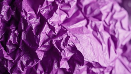 Fototapeta premium A Close Up of Crumpled Purple Tissue Paper, Revealing its Textured Surface and Subtle Light Reflection
