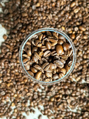 Coffee beans in a glass. lots of coffee beans in a glass bowl.