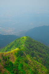 Obraz premium A breathtaking view of a lush, green mountain 