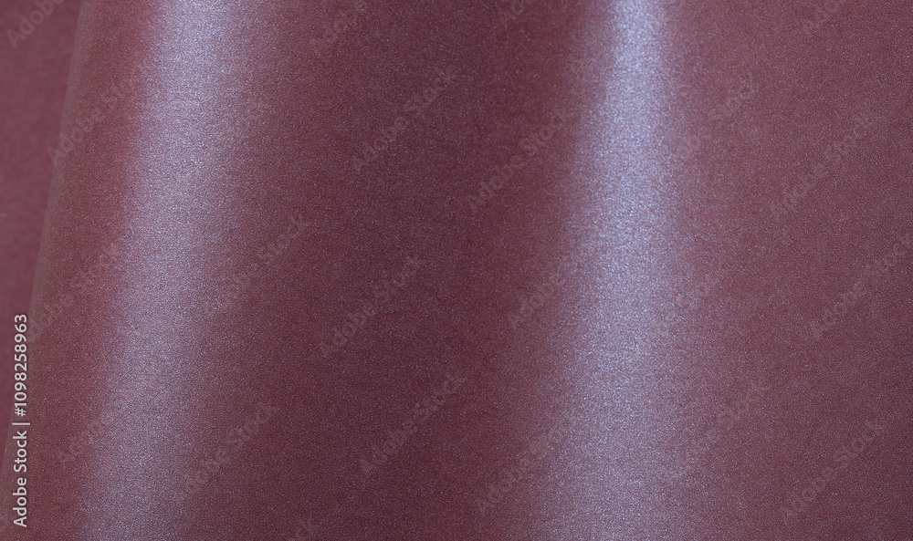 Aufkleber metallic burgundy paper background with a shimmering, glossy surface and soft folds. featuring a ric