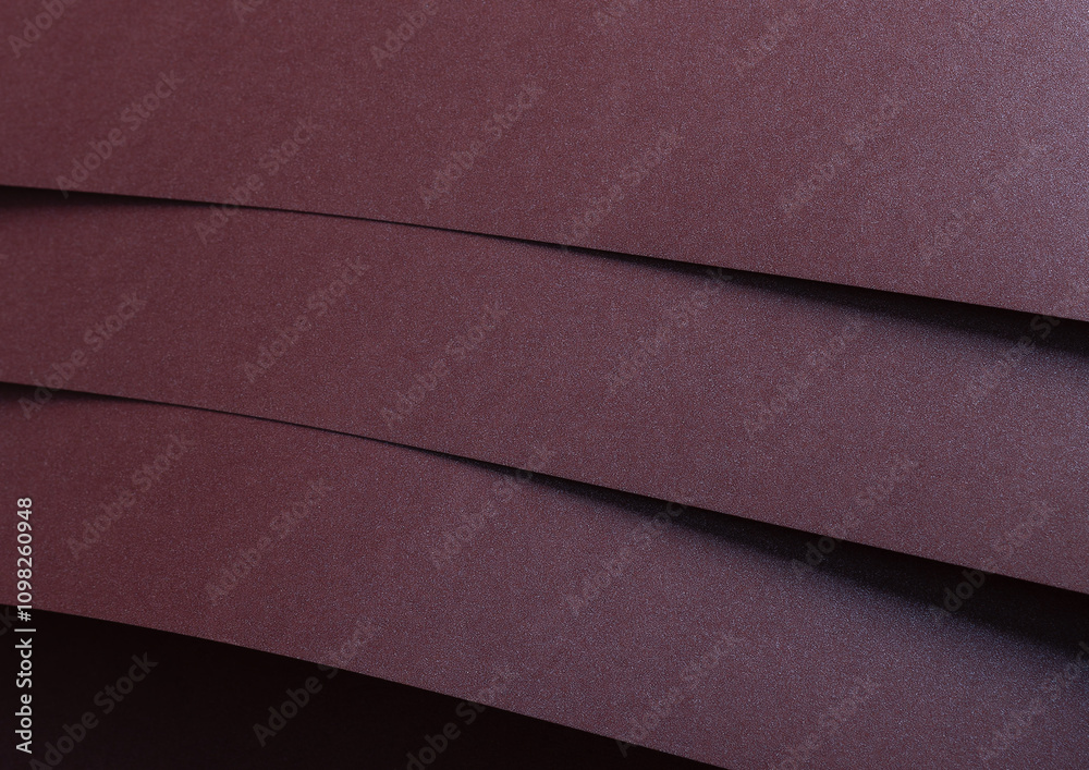 Aufkleber metallic burgundy paper background with smooth, shimmering lines and a reflective surface. featuring