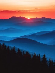 Obraz premium A vibrant sunset paints the sky above a misty mountain range.