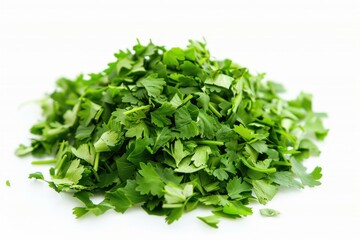 Obraz premium Fresh chopped parsley forming a small mound on white background