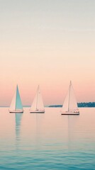 Fototapeta premium Sailing on calm waters with multiple sailboats under a clear blue sky
