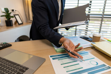A businessman is researching and collecting business information to present and discuss the...
