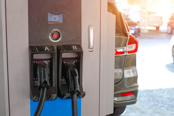 Electric car public parking with charging station. Concept of the use of electric vehicles in a progressive lifestyle contributes clean and healthy environment.