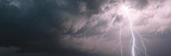 Fototapeta premium Heavy thunderstorm with dramatic lightning striking through dark clouds, striking, stormy, danger